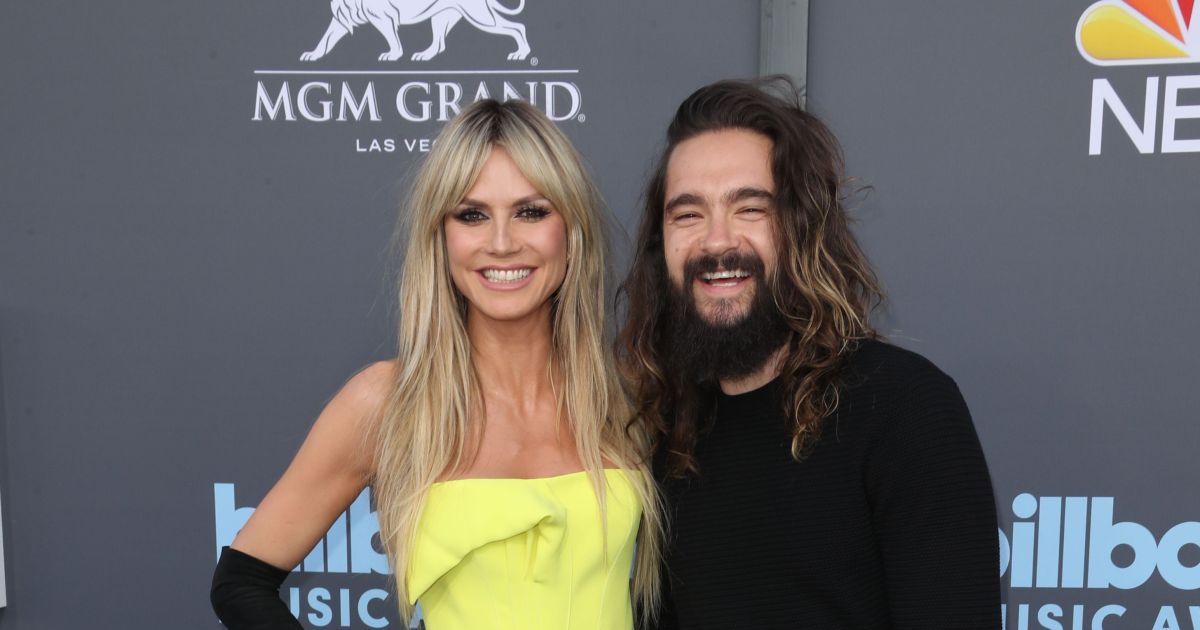 Heidi Klum cuddles up to husband 16 years her junior in coordinating yellow and black looks, plus more stars at the 2022 Billboard Music Awards in Las Vegas.jpg