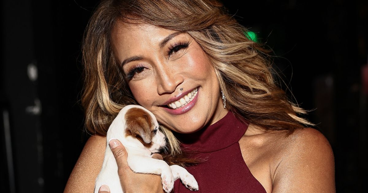 'Dancing With the Stars' beauty snuggles the most adorably tiny puppy, plus more photos of celebs with pets in 2022.jpg