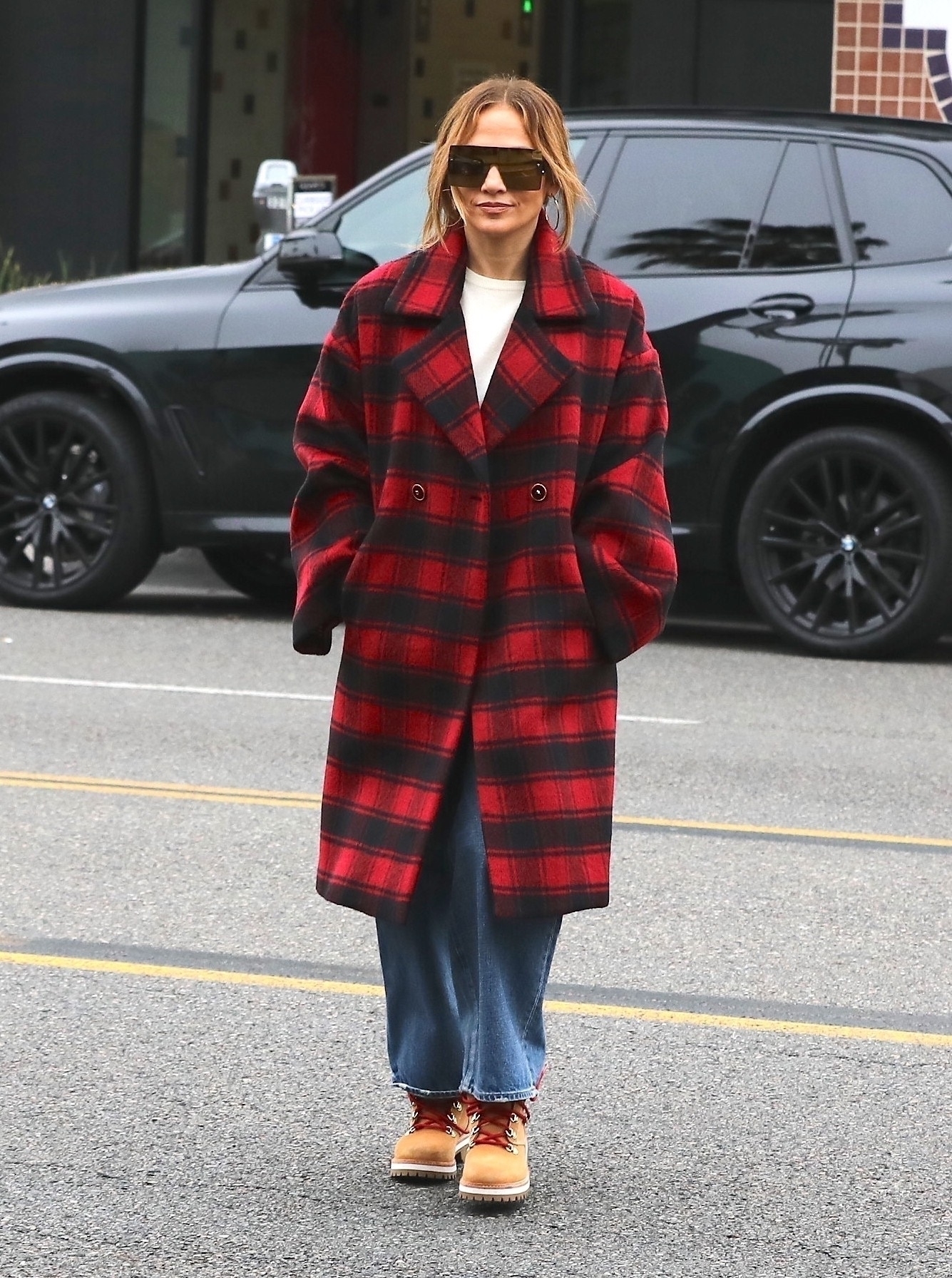 Gigi Hadid Wears a Plaid Coat, Fuzzy Hat for a Walk with Her Baby